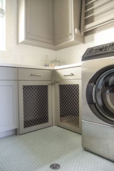 Built-in dog kennel in laundry room inside our Dunstan Custom Home. Built by LBJ Construction in Houston Texas. Laundry Room With Dog Crate, Built In Kennel Laundry Room, Laundry Room With Built In Dog Kennel, Dog Crate In Laundry Room, Laundry Room Dog Crate, Built In Crates For Dogs, Dog Kennel Built In, Dog Area In Laundry Room, Laundry Room With Dog Area