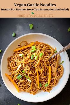 a white bowl filled with noodles and vegetables