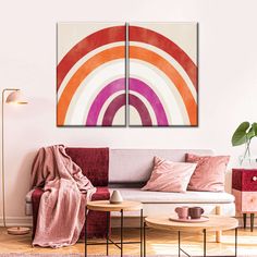 a living room with two paintings on the wall