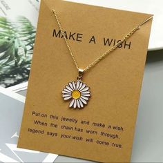 a necklace with a flower on it that says make a wish