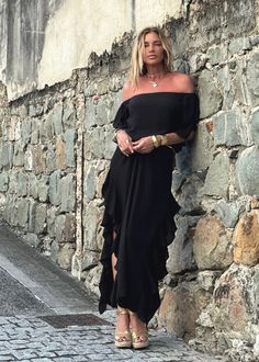 Indulge in the chic style of the Lucy Dress, featuring an off-the-shoulder design, delicate ruffled sleeves, and side seams with romantic ruffles. Modern side openings and a flowing maxi length complete the look. The double-layered body and single layered sleeves create a tantalizing contrast. Elevate your ensemble by pairing it with our Signature belts Elastic on Sleeve 100% Chiffon Lining 100% Chiffon Dry clean or Hand Wash or Delicate Cycle Wash and Hang Dry Designed with love in Miami, FL US Floor-length Ruffled Maxi Dress For Evening, Evening Floor-length Maxi Dress With Ruffled Skirt, Summer Formal Off Shoulder Dress With Ruffles, Strapless Chiffon Maxi Dress With Ruffles, Flowy Ruffled Maxi Dress For Gala, Chic Off Shoulder Ruffle Dress For Cocktail, Elegant Flowy Off Shoulder Dress With Ruffles, Elegant Flowy Ruffled Off Shoulder Dress, Chic Off Shoulder Cocktail Dress With Ruffles