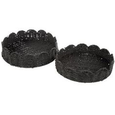 two black woven baskets sitting next to each other on a white background, one is empty and the other has no lid