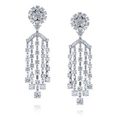 A stunning cascade of round and baguette-cut diamonds forming a dramatic chandelier drop earring that will turn heads. Length measures approximately 83mm from top to bottom, and approximately 24mm wide. These gorgeous chandelier earrings have approximately 38 carats total weight and are made in platinum. MATERIAL: Platinum DIAMONDS: Round Cuts, Baguette Cuts, One Trilliant-Cut in each earring QUALITY: F-G color, VS-SI clarity Length: 83mm (or 3.2inches) Closure: Omega back with post with rubber Dramatic Chandelier, Diamond Chandelier Earrings, Diamond Chandelier, Emerald Cut Diamond Ring, Diamond Baguette, Platinum Earrings, Baguette Cut Diamond, Diamond Drop Earrings, Art Deco Earrings