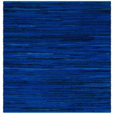 a blue rug with fringes on the bottom, and one stripe in the middle