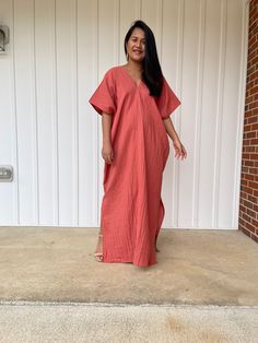 Embrace the gentle waves and sunny shores with our double gauze cotton kaftan. This versatile caftan falls gracefully between the knees or ankles, depending on the length you choose. It's the ultimate in loungewear for women - perfect as a beach dress or cover up. Crafted from light and airy double gauze cotton, it's your essential for a night on the town, a day by the sea, or just running errands. V-neck Maxi Dress For Beach Season Loungewear, Breezy V-neck Loungewear Dress, Casual V-neck Kaftan For Daywear, Casual V-neck Relaxed Fit Kaftan, Flowy Short Sleeve Maxi Dress For Loungewear, Flowy Maxi Dress With Short Sleeves For Loungewear, Breezy Relaxed Fit Dress For Loungewear, Beachwear Kaftan With Short Sleeves In Relaxed Fit, Beachwear Kaftan With Short Sleeve And Relaxed Fit