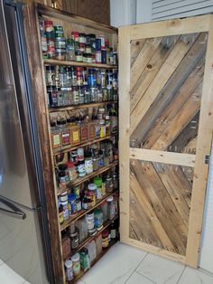 an open cabinet with canned food in it