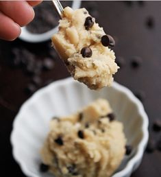 a spoon full of cookie dough and chocolate chips