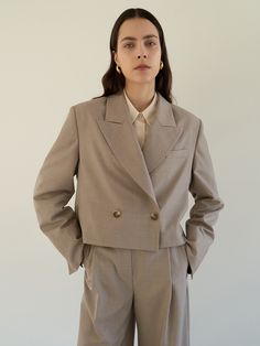 Editor's notesThis cropped suit jacket with a peaked collar feels nothing as heavy as your normal mid-length blazer. - Summer wool material- Cropped length jacket- Peaked collar, one-button detail- Shoulder pad- Fully lined- Set up with Layered belt wide trouser by MOHANMeasurements(in.)- Size: S, M- Shoulder: 17.52in / 18.11in    - Chest: 20.87in / 21.85in- Hem: 20.67in / 21.65in  - Sleeve: 24.41in / 24.61in- Length: 19.29in / 19.49in- Model size: 5' 6 / Bust: 31.5in / Waist: 23.5in / Hip: 34in and wearing a size SmallComposition & Care- 50% Polyester, 50% Wool- Dry clean onlyDesigner- by MOHAN Single Breasted Cropped Jacket With Lapel Collar For Office, Tailored Cropped Jacket With Notch Lapel For Semi-formal Occasions, Business Cropped Jacket With Notch Lapel And Hidden Buttons, Single-breasted Cropped Jacket With Notch Lapel For Office, Semi-formal Single Breasted Cropped Jacket With Lapel Collar, Workwear Cropped Jacket With Notch Lapel, Tailored Cropped Jacket With Lapel Collar For Work, Workwear Cropped Jacket With Double Button And Notch Lapel, Cropped Single Breasted Blazer For Work