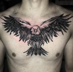 a man with an owl tattoo on his chest