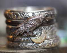 Five mysterious solid sterling silver rings. One ring is a darkened ring with a raven, darkly antiqued and polished. Another ring features a beautiful 14kt gold filled crescent moon. Three more additional patterned solid sterling rings, just as pictured. Any size Other variations/combinations possible, please ask. Witchy Ring, Witchy Jewelry Rings, Mystical Sterling Silver Rings, Black Mystical Style Jewelry Ring, Rings Witch Aesthetic, Spider Ring, Crow Ring, Witchy Rings Silver, Afro Jewelry