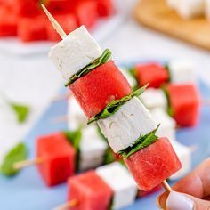 watermelon and feta skewers on a stick with mint garnish