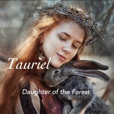 a woman holding a rabbit in her arms with the words taurell on it