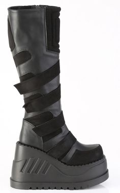 The stompiest boots around! These chonky wedges are a gift from the platform gods, slip in and stomp around babey!!! Vegan Black stretch PU leather 4 3/4 (121mm) inch platform Featuring Contrast Puffed Cyber Style Panels & Ornamental Hook-N-Loop Strap Details Inside zip closure U.S. women's sizing-refer to size chart for more info. Post Apocalyptic Clothing, High Platform Boots, Apocalyptic Clothing, Knee High Platform Boots, Demonia Shoes, Cyberpunk Fashion, Chunky Shoes, Black Knees, Black Vegan