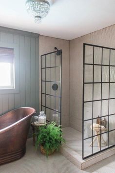 an image of a bathroom setting with plants in the tub and on the shower wall