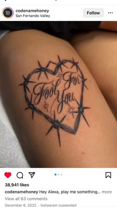 a woman's thigh with barbed wire and the words god for you on it