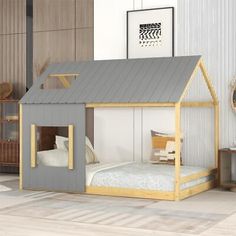 a child's bed with a little house on the top and bottom bunk above it