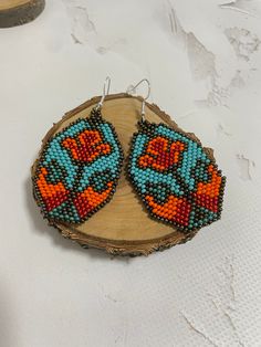 Beautiful earrings in native American style . Made of Czech beads Length 3 inches(7 cm) Width 1.5 inches(3.5 cm) Hypoallergenic clasp If you want these earrings in a different color, write to me and I will be happy to make them for you. >Back to my shop: https://www.etsy.com/shop/jewelrybylarisa?ref=seller-platform-mcnav Handmade Turquoise Flower-shaped Earrings, Turquoise Flower Beaded Earrings For Gift, Turquoise Earrings With Large Beads For Gifts, Southwestern Style Large Beads Earrings For Gift, Southwestern Style Beaded Earrings With Ear Wire As Gift, Handmade Turquoise Flower Earrings, Turquoise Beaded Dangle Flower Earrings, Handmade Turquoise Flower Earrings With Round Beads, Bohemian Beaded Earrings In Flower Shape For Gifts