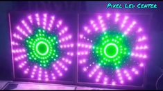 two green and purple lights in the shape of circles on a black background with text overlay