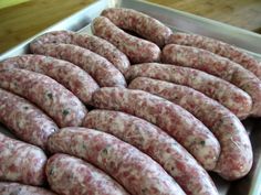 several sausages in a pan ready to be cooked