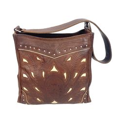 This exquisite shoulder bag showcases intricate tooled leather craftsmanship, accented with white cutouts and decorative studs. The rich brown leather provides a timeless and sophisticated look, making it ideal for those who appreciate artisanal quality and unique design in their accessories. * Tooled leather design * Accented with white cutouts * Decorative studs * Spacious interior * Sturdy shoulder strap * Handcrafted quality * Rich brown leather Features: * Hand Made, Hand Tooled, Vintage Size: Womens 10.5 x 9.5 by 3" Condition: Pre-Owned Good Very small tear bottom left hand side of bag Engraved Brown Shoulder Bag For Everyday Use, Brown Engraved Shoulder Bag For Everyday Use, Traditional Brown Embossed Bags, Elegant Hand-tooled Brown Shoulder Bag, Elegant Brown Hand-tooled Shoulder Bag, Luxury Brown Engraved Bags, Elegant Brown Hand Tooled Shoulder Bag, Brown Leather Engraved Shoulder Bag, Brown Leather Hand Tooled Shoulder Bag