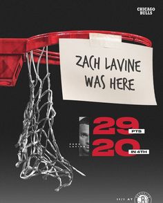 a basketball net with a sign attached to it that says zac lavine was here