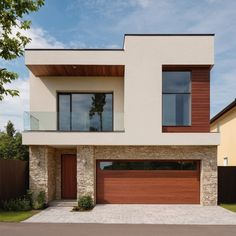 a modern house with two garages on the side