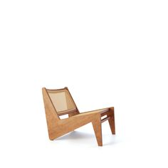 a wooden chair sitting on top of a white floor