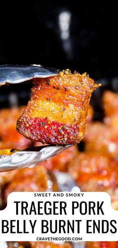 a piece of food is being held up by a fork with text overlay that reads, traeger pork belly burnt ends