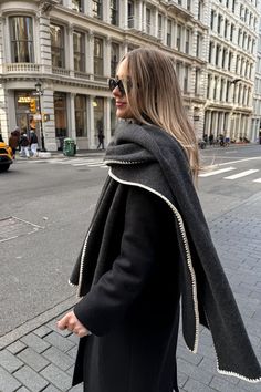 Fashion Jackson Wearing Toteme Embroidered wool and cashmere scarf Toteme Black Double Breasted Wool Coat Bottega Veneta Teen Jodie Black Handbag new york outfits for winter soho street style 1 Dark Jeans Outfit, Nyc Street Style Fall, Work Blazer Outfit