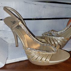 Light Gold Rhinestone And Glitter Heels. These Have Only Been Worn Once. Very Clean. There Is A Very Small Spot On The Outer, Lower Band Where The Glitter Has Came Off. You Cannot See It When You Have Them On. Heel Height Of 4.5" I Do Live In A Smoker's Home. Please Be Kind And Remember...Items Can Be Washed Or Sprayed With A Fabric Spray. The Smell Will Come Out! I Do Wash All Items Before Shipping, Unless They Are New With Tags, Leather, Or Shoes. I Will Do My Best To Ship Them To You With Lov Bedazzled Gold Heels For Party, Gold Bedazzled Heels For Party, Sparkling Synthetic Heels For Prom, Party Gold Bedazzled Heels, Bedazzled Gold Open Toe Heels, Elegant Bedazzled Gold Sandals, Gold Heels With Rhinestones In Synthetic Material, Gold Synthetic Heels With Rhinestones, Elegant Gold Bedazzled Sandals