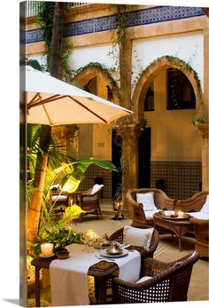 an outdoor dining area with tables and chairs