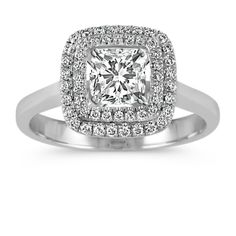 an engagement ring with a square cut diamond surrounded by round brilliant pave halos