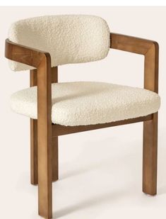 a white chair with wooden frame and arms