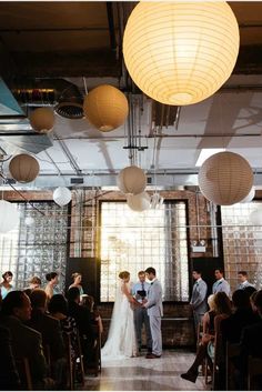 the bride and groom are getting married in front of their guests at this wedding ceremony