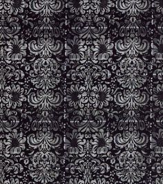 black and white wallpaper with an intricate design on it's side, in the middle