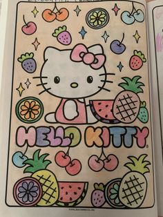 the hello kitty coloring book is open to show it's pages and features fruit