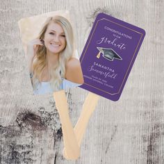 a purple and gold graduation photo on a wooden skewer with the word congratulations