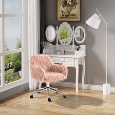 a pink chair sitting in front of a desk with a mirror on top of it