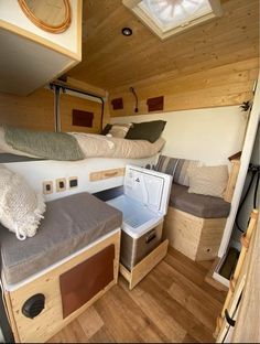 the inside of a tiny house with bunk beds and washer dryer in it