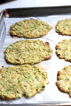 some food is sitting on a baking sheet and ready to be cooked in the oven