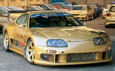 a gold sports car parked in a parking lot