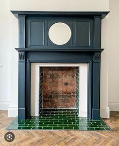 a fireplace with a clock on top of it