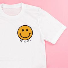 Bistec Happy Face T-Shirt Cute White T-shirt With Smiley Face, White Relaxed Fit Top With Smiley Face, White Smiley Face Top With Relaxed Fit, White Smiley Face Crew Neck Top, White Crew Neck Top With Smiley Face, White Graphic Tee With Smiley Face, White Smiley Face Graphic Tee, Smiley Face Yellow, Ice Shirt