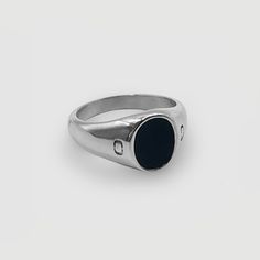 Onyx is a protector stone: Renowned for enhancing both self-confidence and discipline. CRAFTD for any occasion. This Silver Signet Ring showcases a solid Oval Onyx, hand-set within a premium Cabochon inlay: an expert technique known for unlocking the gemstone's richest and deepest natural colour.Its classic design, paired with an ultra-durable, scratch-resistant band, makes it a lasting and versatile addition to any collection—the perfect choice for morning, noon, and night. ✓ Rhodium & 316L Sta Classic Oval Rings With Si Clarity, Silver Tarnish Resistant Oval Ring, Silver Tarnish-resistant Oval Ring, Minimalist Silver Onyx Signet Ring, Everyday Black Sterling Silver Signet Ring, Everyday Silver Onyx Jewelry, Silver Onyx Signet Ring With Polished Finish, Silver Onyx Signet Ring, Silver Onyx Signet Ring Gift