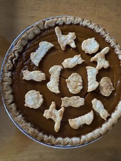 a pie topped with lots of dog treats