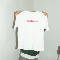 I Could Never Funny Slogan Tik-Tok Viral. Perfect for a fun gift! A classic unisex t-shirt that works well with any outfit. Made of a heavier cotton with a double-stitched neckline and sleeves.- Rolled-forward shoulders for a better fit- Stylish fitted sleeve- Seamless double-needle collar- Taped neck and shoulders for durability- Tubular fit for minimal torqueThis product is made on demand. No minimums. White Cotton Slogan T-shirt, Basic White Ring-spun Cotton T-shirt, White Basic Ring-spun Cotton T-shirt, White Crew Neck T-shirt Band Merch, Everyday White Ring-spun Cotton Tops, Everyday Crew Neck T-shirt In Ring-spun Cotton, Everyday Screen Print T-shirt In Ring-spun Cotton, White Organic Cotton Crew Neck Shirt, Basic Crew Neck Ring-spun Cotton T-shirt