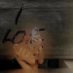 an image of a woman with glasses and the word love spelled out in front of her