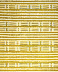 a yellow and white rug with lines on it