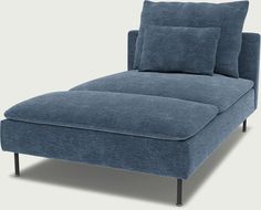 a blue chaise lounger with two pillows on it's back and legs