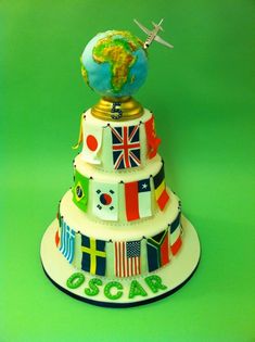 a cake with flags and an airplane on top